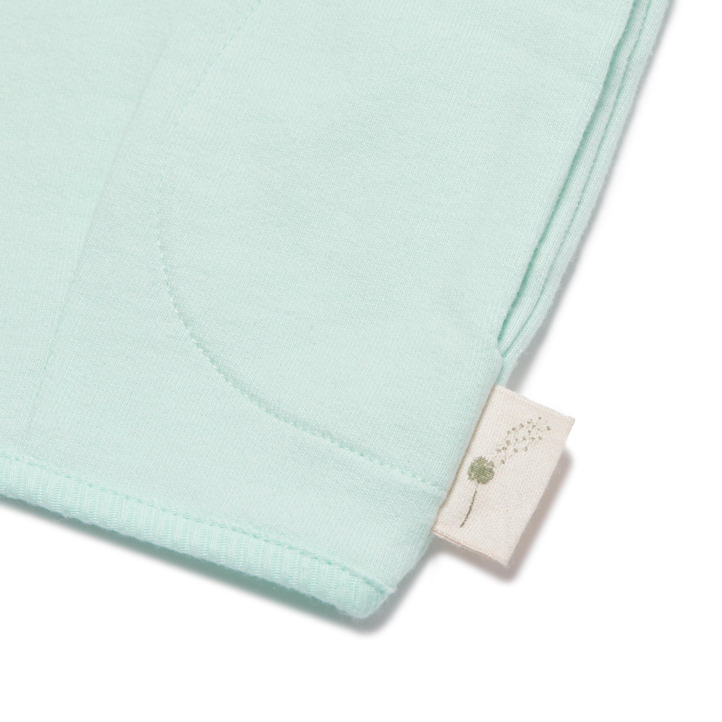 Light blue fabric with a brand tag on a white background