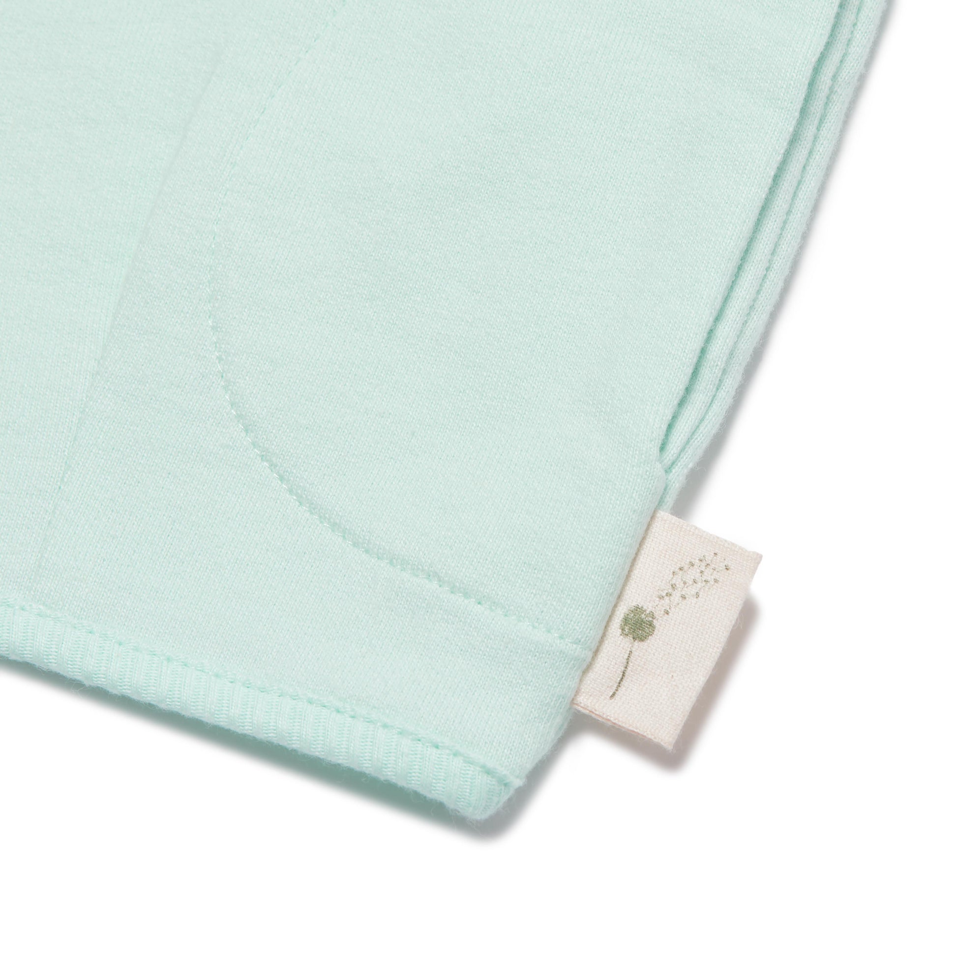 Light blue fabric with a brand tag on a white background