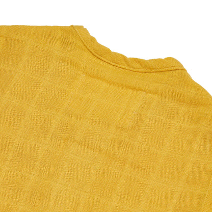 Close-up of a yellow fabric texture on a white background