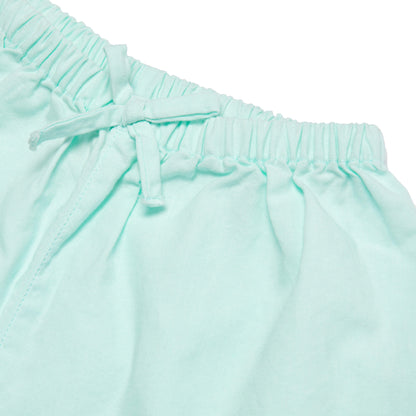 Close-up of light blue pants with an elastic waistband on a white background